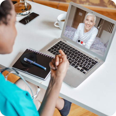 Woman talking to doctor on computer