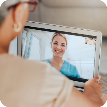 Woman talking to doctor on laptop